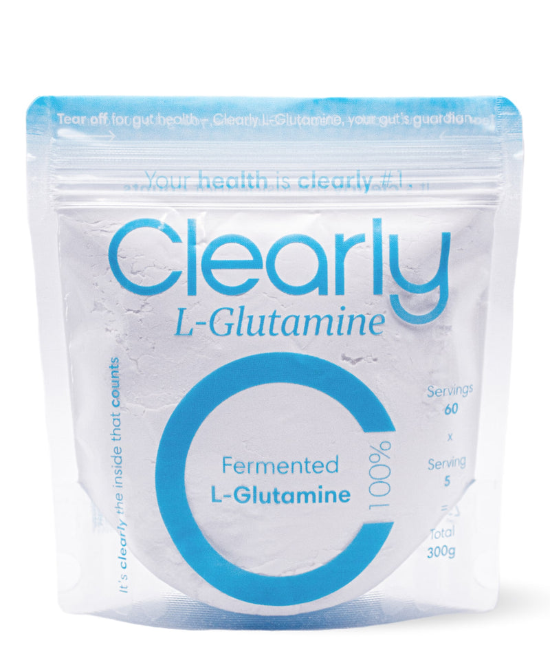 Clearly L-glutamine supplement container with white label showing product name and dosage information.